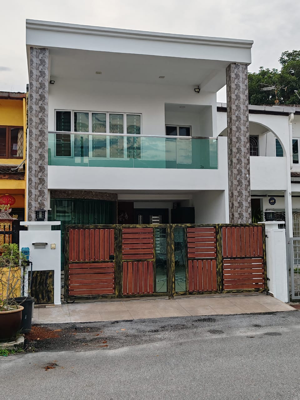 Front exterior of the double-storey Taman Daya terrace house